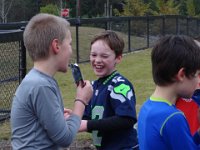 Sam's 9th flag football party 069  Sam has just squirted some of his buddies with Capri Sun juice! : Sam's 9th flag football party