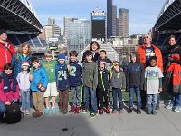 #SC00533  Seattle-ites not used to the sun so we are all squinting! Funny thing - we actually had 12 kids on this tour. One had to leave for a basketball game by the time we took this photo. The lady in the purple used to work for the Seahawks, so that was pretty cool to have her perspective. Such a great group. Thanks so much for a good time, guys!