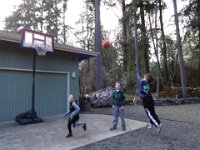 DSC00460  Friend and neighbor Kai over shooting hoops.
