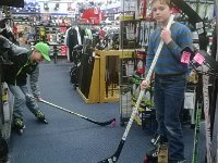 WP 20140218 001  Now we are at Big 5. We are interested in trying roller hockey, so we watched the 1980 Men's Olympic hockey win over the USSR this morning (original footage) then set off to get us some blades (there is no ice rink nearby, so we are joining the local roller hockey team). Ben's skates will fit size 1-4 - they have a slide-out feature which is really cool. Sam's skates, we later learned upon checkout, were 70% off!!! He got them for $21.97!!!!