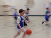 photo  Our friend, 5th grader Nate, caught this picture at the last basketball game. WHAT a riveting game that was! Like being at the Olympics! The kids played their hearts out and lost only by 2 points. It was a great, close game.