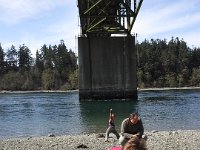 20140331 145505  Looking for agate under the Agate Pass Bridge. Sounds like a reasonable plan, right? Except for shoreline access issues and uptight barking dogs! See Ben in the background? He posed this way and made sure I got a picture of him doing this.