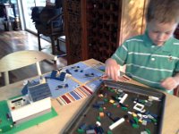 20140530 181822  Ben building a really neat Lego house that has tons of windows!