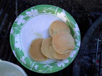 20140626 083529  Mommy cooks better over a fire. See, no black pancakes!