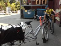 20140811 150916  Buying 50 lbs of chicken feed then biking home with it. AND 10 lbs of rocks. UGH!