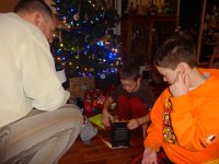 DSC01782  And Ben's face says it all - a Kindle! This was not on Mommy's approved list of gifts, but Daddy insisted...