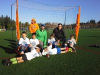 20151121 094655  Taking end of season pictures for Ben's soccer team. Look who's photobombing! I didn't even notice Sam in the back. He's so funny standing there in his hoodie, quietly.