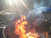 20151126 141940  Richard and I are burning the downed pine limbs from around the property while turkey cooks inside (THANK YOU, DAVE!)