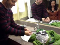 20151223 162213  Getting snow and ice out of jackets and trying to dry gear out in the cabin's dryer before dinner.
