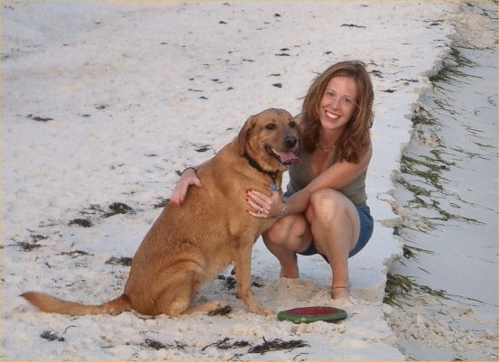 Doggie girl having the time of her life on Pensacola beach in 2003 enroute to CA. See frisbee?