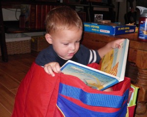 It's still raining out! So we had fun at a playground with some school friends, then hunkered down. Sam polished off his vacation homework in one sitting, and did some more math with me. Now we are playing board games and getting into mischief while sorting letters and numbers. Ben is packaging himself in this box saying "Ok go to bed! No thumping tonight!"